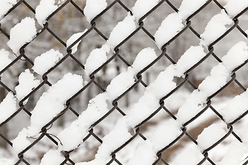 Image showing metal grating covered snow