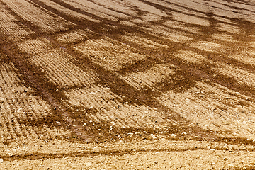 Image showing plowed field and trail traces