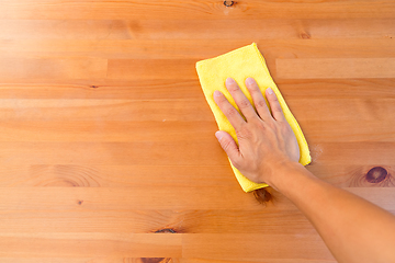 Image showing Top view of hand cleaning table with yellow cloth 