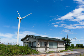 Image showing Wind turbine and house