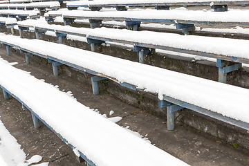 Image showing wooden bench under the snow