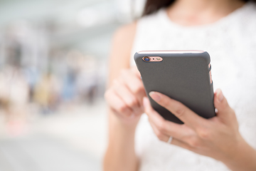 Image showing Woman surfing internet on mobile phone