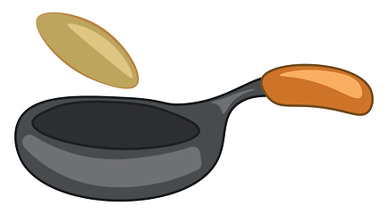 Image showing An iron frying pan with brown handle and a pan cake flipped to t
