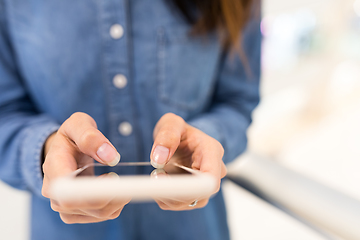 Image showing Woman working on cellphone