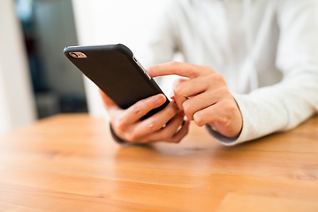 Image showing Woman touching on cellphone