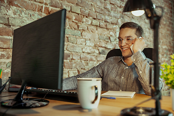 Image showing Man working from home during coronavirus or COVID-19 quarantine, remote office concept