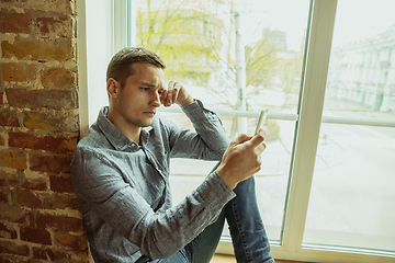 Image showing Man working from home during coronavirus or COVID-19 quarantine, remote office concept