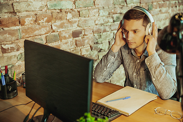 Image showing Man working from home during coronavirus or COVID-19 quarantine, remote office concept