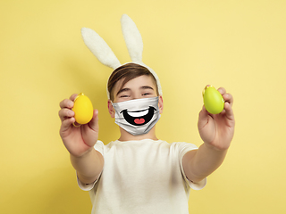 Image showing Portrait of young caucasian boy with emotion on his protective face mask