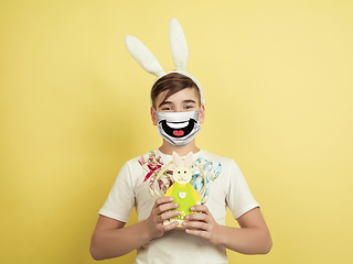 Image showing Portrait of young caucasian boy with emotion on his protective face mask