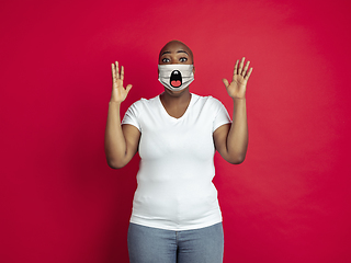 Image showing Portrait of young african-american woman with emotion on her protective face mask