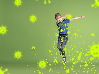 Image showing How to sneezing right - caucasian boy dabbing in jump, stop epidemic