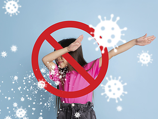 Image showing How to sneezing right - caucasian girl dabbing, stop epidemic