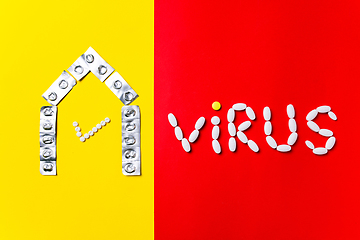 Image showing Colored pills, tablets and capsules on a red and yellow background - history of treatment, prevention of pandemic