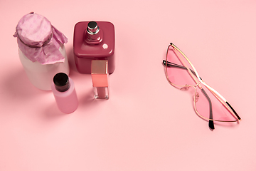 Image showing Cosmetics, fashion. Monochrome stylish composition in pink color. Top view, flat lay.