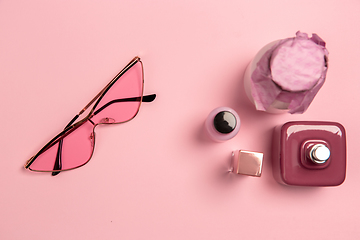 Image showing Cosmetics, fashion. Monochrome stylish composition in pink color. Top view, flat lay.