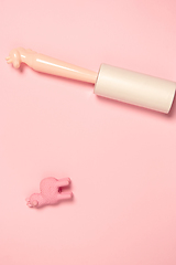 Image showing Wear roller and toy. Monochrome stylish composition in pink color. Top view, flat lay.