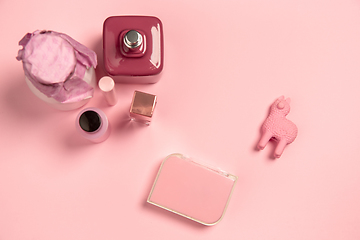 Image showing Cosmetics, fashion. Monochrome stylish composition in pink color. Top view, flat lay.