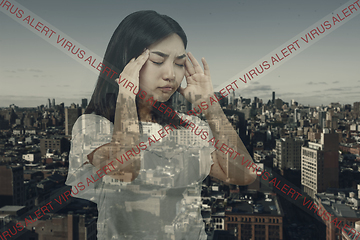 Image showing Stressed woman holding head with hands on abstract city background. Double exposure. Virus alert, coronavirus pandemic.