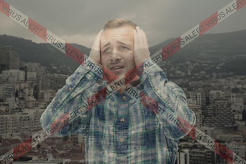 Image showing Stressed man holding head with hands on abstract city background. Double exposure. Virus alert, coronavirus pandemic.