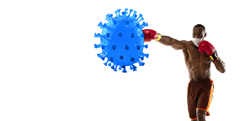 Image showing Sportsman kicking, punching coronavirus, protection and treatment concept, flyer