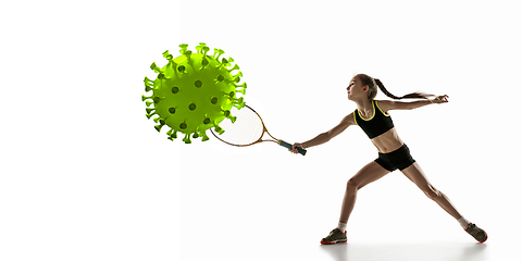 Image showing Sportsgirl kicking, punching coronavirus, protection and treatment concept, flyer