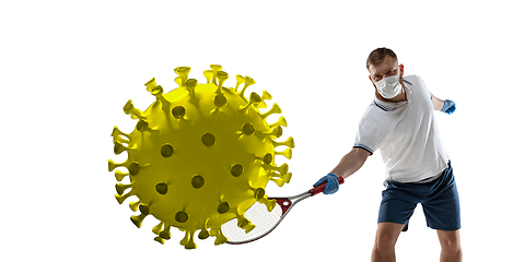 Image showing Sportsman kicking, punching coronavirus, protection and treatment concept, flyer