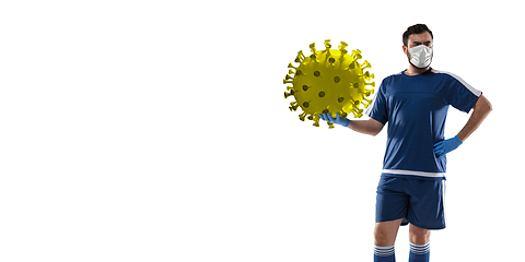 Image showing Sportsman kicking, punching coronavirus, protection and treatment concept, flyer