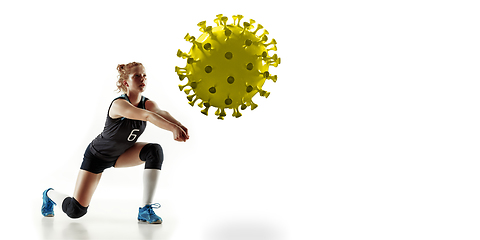 Image showing Sportswoman kicking, punching coronavirus, protection and treatment concept, flyer