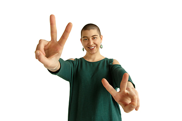 Image showing Portrait of young woman with freaky appearance on white background