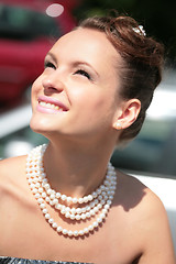 Image showing smiling girl with pearl necklace