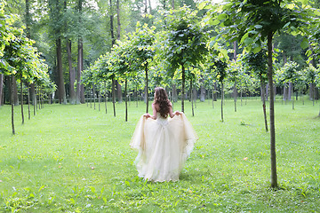 Image showing girl walks in the summer park