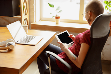 Image showing Woman working from home during coronavirus or COVID-19 quarantine, remote office concept