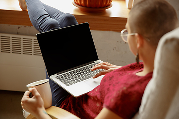 Image showing Woman working from home during coronavirus or COVID-19 quarantine, remote office concept