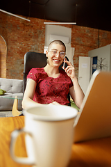 Image showing Woman working from home during coronavirus or COVID-19 quarantine, remote office concept