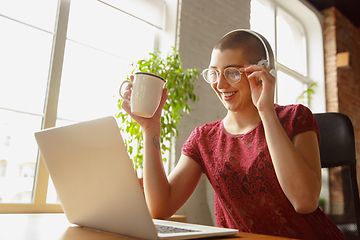 Image showing Woman working from home during coronavirus or COVID-19 quarantine, remote office concept