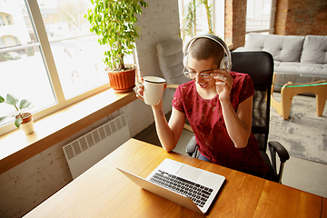 Image showing Woman working from home during coronavirus or COVID-19 quarantine, remote office concept