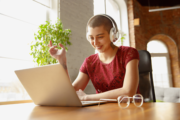 Image showing Woman working from home during coronavirus or COVID-19 quarantine, remote office concept