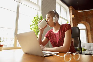 Image showing Woman working from home during coronavirus or COVID-19 quarantine, remote office concept