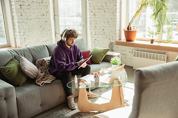 Image showing Man working from home during coronavirus or COVID-19 quarantine, remote office concept