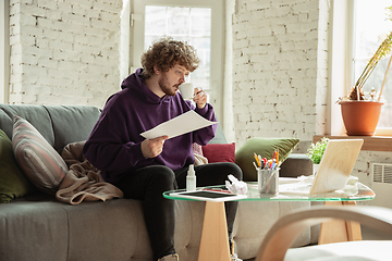 Image showing Man working from home during coronavirus or COVID-19 quarantine, remote office concept