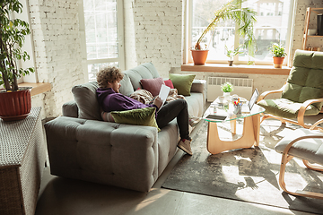 Image showing Man working from home during coronavirus or COVID-19 quarantine, remote office concept