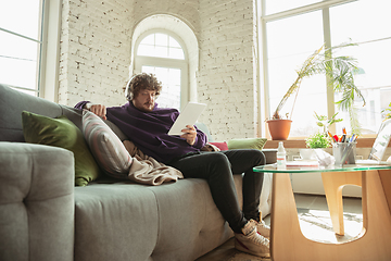 Image showing Man working from home during coronavirus or COVID-19 quarantine, remote office concept