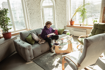 Image showing Man working from home during coronavirus or COVID-19 quarantine, remote office concept