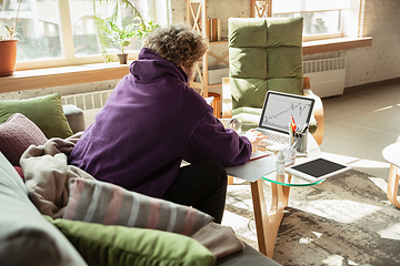 Image showing Man working from home during coronavirus or COVID-19 quarantine, remote office concept