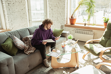 Image showing Man working from home during coronavirus or COVID-19 quarantine, remote office concept