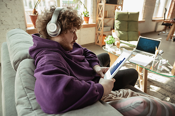 Image showing Man working from home during coronavirus or COVID-19 quarantine, remote office concept