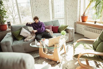 Image showing Man working from home during coronavirus or COVID-19 quarantine, remote office concept