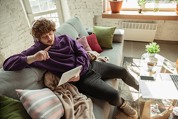 Image showing Man working from home during coronavirus or COVID-19 quarantine, remote office concept