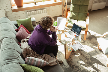 Image showing Man working from home during coronavirus or COVID-19 quarantine, remote office concept